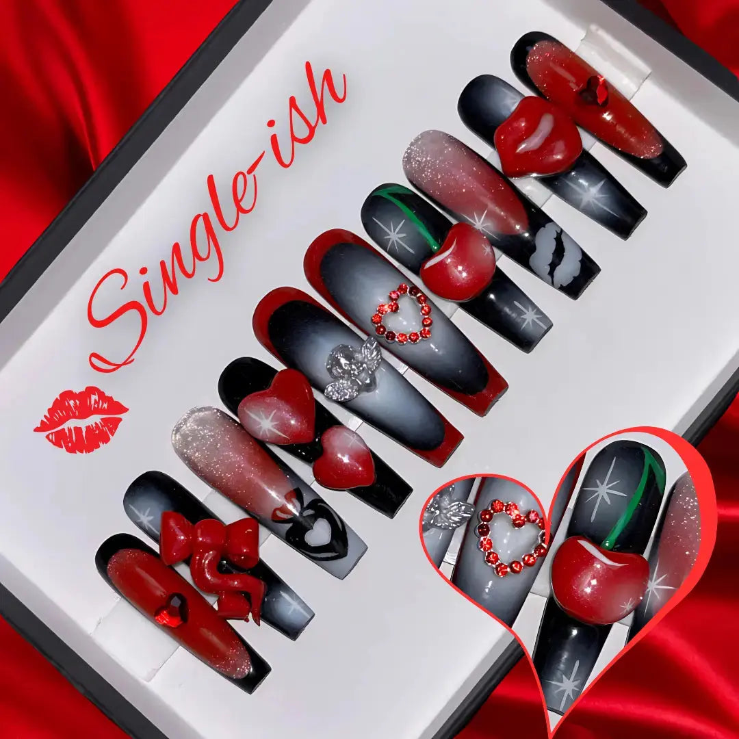 Red and black press-on nails with 3d hearts, bows and cherryās